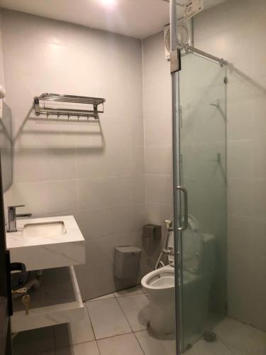 a bathroom with a shower and a sink and a toilet at Authentic Mia Rooftop Mountains view with egg coffee in Sóc Sơn