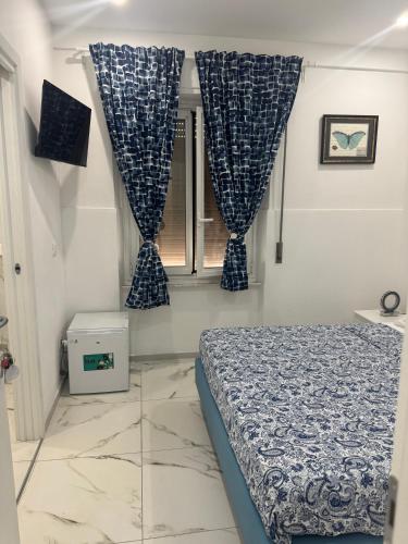 Postel nebo postele na pokoji v ubytování Iris Affitacamera