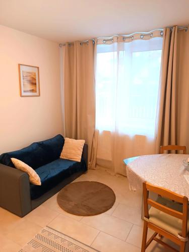 a living room with a couch and a table at Family Apartments Tauchen in Mönichkirchen