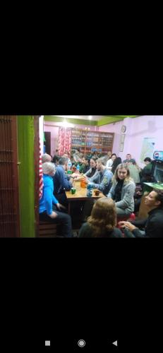 a group of people sitting at tables in a room at KharidhugaHotel and lodge in Rāmechhāp