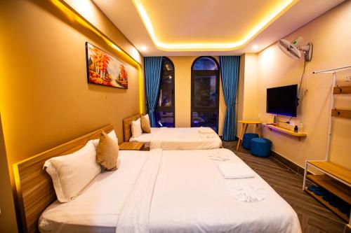 Кровать или кровати в номере Teddy 108 Homestay & Cafe - 3 stars - Grand World Phu Quoc