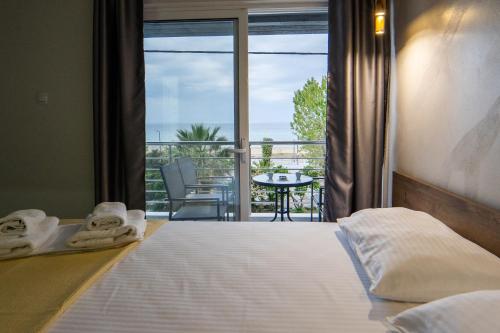 Ένα ή περισσότερα κρεβάτια σε δωμάτιο στο Nikolaidis Apartments
