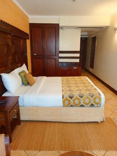 The Heron By Sarovar Portico Indiaにあるベッド