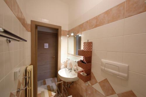 a bathroom with a sink and a mirror at Hotel Primavera in Peschiera del Garda