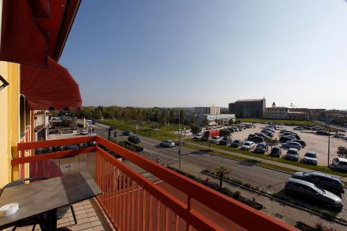 a balcony with a view of a parking lot at Hotel Primavera in Peschiera del Garda