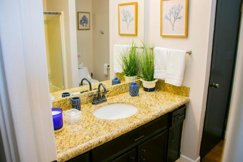 a bathroom with a sink and a mirror at Villa de La Rosa with Pool & BBQ Area Wine Country in San Pablo