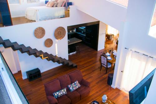 a living room with a couch and a bed in a room at Villa de La Rosa with Pool & BBQ Area Wine Country in San Pablo