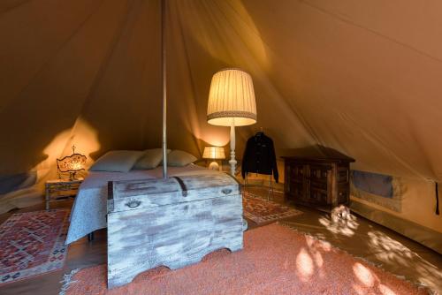 Postel nebo postele na pokoji v ubytování Glamping Serraiola Alta