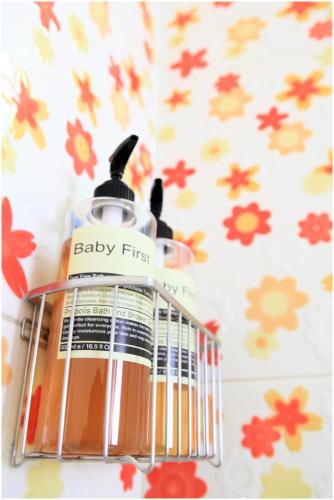 a bottle of baby fits sitting on top of a counter at Errantry Lodge & Studio in Hualien City
