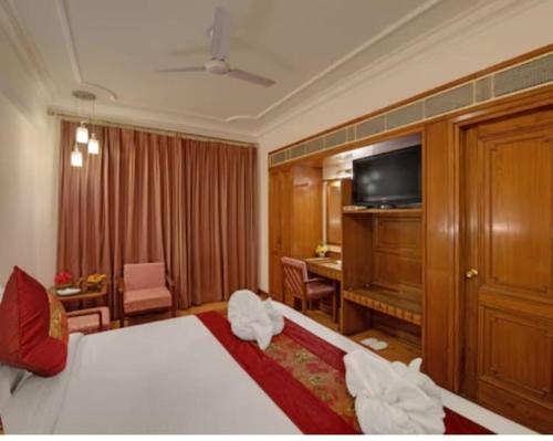 Postel nebo postele na pokoji v ubytování hotel Baljees Regency