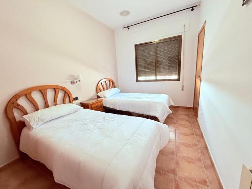 Postel nebo postele na pokoji v ubytování Hostal Castilla