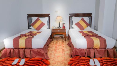 Ένα ή περισσότερα κρεβάτια σε δωμάτιο στο Tirar International Hotel
