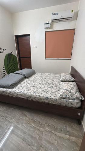 a bedroom with a bed in a room at Simple Belle by Half Orangee with Swimming Pool ,Near to Beach -Clubs - Hill Top best for Corporate Bookings-Summer vacation!! in Vagator