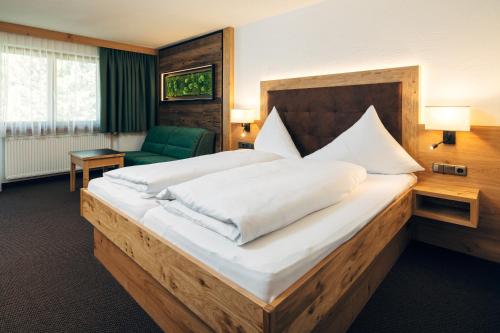 Postel nebo postele na pokoji v ubytování Hotel Barbara