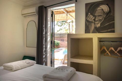 Ένα ή περισσότερα κρεβάτια σε δωμάτιο στο Villa Em