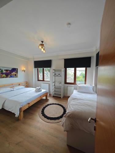a bedroom with two beds and a door open at family villas sapanca in Sapanca