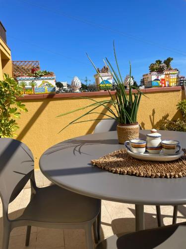 a table and chairs sitting on a patio at Tao enJoy Suite in Taormina