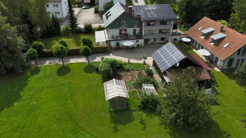 an aerial view of a house with a solar roof at Pension Birkenhof in Hengersberg