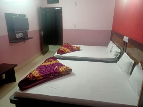 Katil atau katil-katil dalam bilik di New Yatrik Hotel