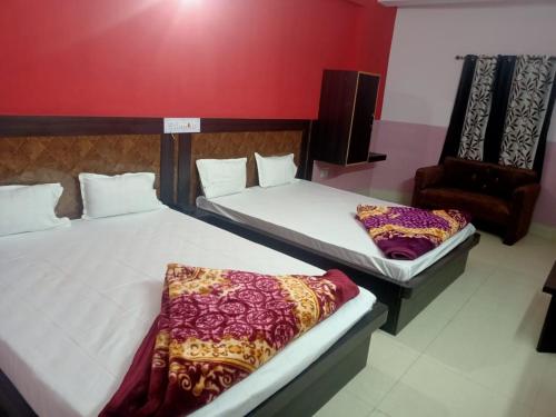 Katil atau katil-katil dalam bilik di New Yatrik Hotel