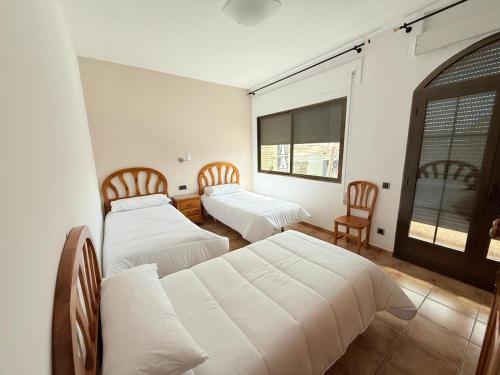 Postel nebo postele na pokoji v ubytování Hostal Castilla
