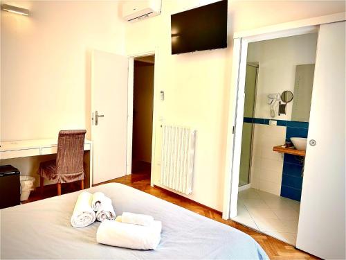 a hotel room with a bed with towels on it at Don Nicola Tourist Location in Polignano a Mare