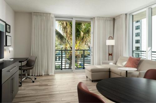 a living room with a couch and a table at Residence Inn by Marriott Miami Beach Surfside in Miami Beach