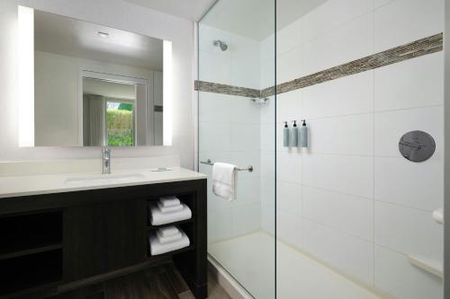 a bathroom with a sink and a shower at Residence Inn by Marriott Miami Beach Surfside in Miami Beach