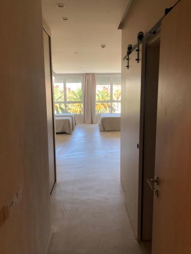an empty hallway with two beds in a room at El Globo in Valencia