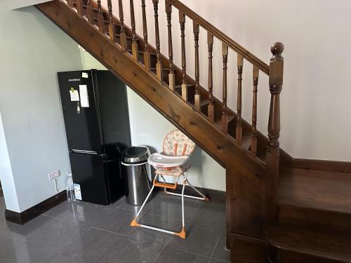 a staircase with a chair and a trash can at Matilda house in Ferbane