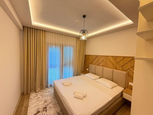 Postel nebo postele na pokoji v ubytování Vujanović Apartments