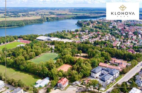 an estate in the middle of a river with a house at Apartament Klonova z tarasem in Olecko