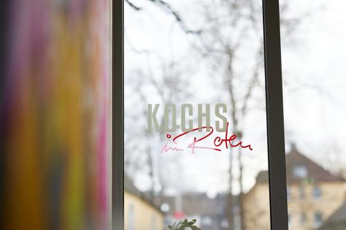 a window with the words kosciuszko forever written on it at Kochs Stadthotel in Olpe