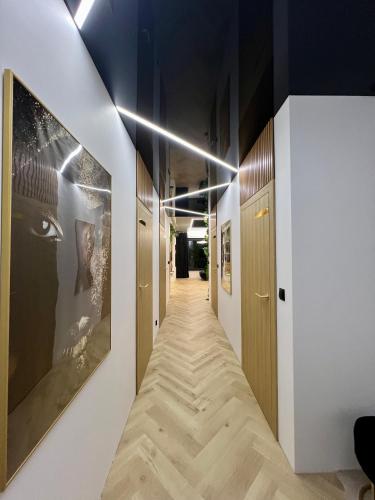 a corridor of a hallway with a long hallway at VIP GOLD Warszawa Parking FREE in Stefanowo
