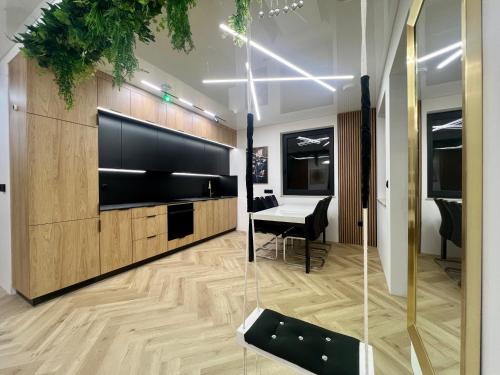 a living room with a table and a piano at VIP GOLD Warszawa Parking FREE in Stefanowo