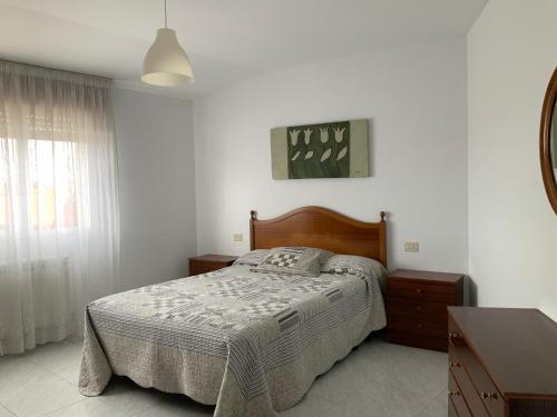 Ένα ή περισσότερα κρεβάτια σε δωμάτιο στο Piso en O GROVE