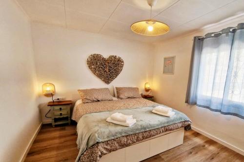 Postel nebo postele na pokoji v ubytování La Casita, a 2 min a pie de la playa!