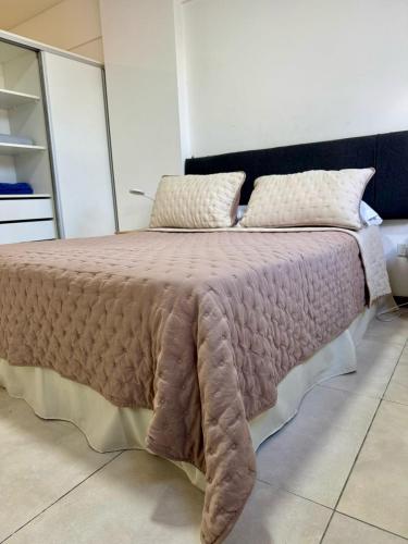 a bedroom with a large bed in a room at Departamento Independencia in Buenos Aires