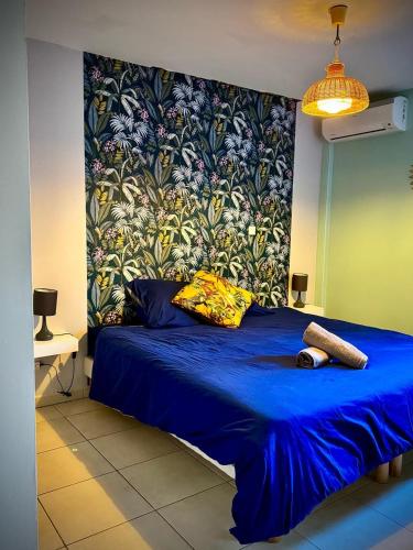 Giường trong phòng chung tại Résidence tropicale