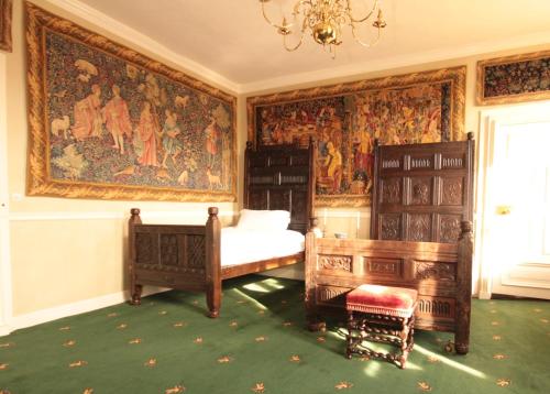 a bedroom with a large tapestry on the wall at Appleby Castle in Appleby