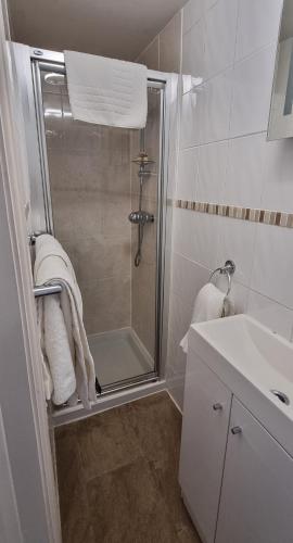 a bathroom with a shower and a sink at The Old Bakery in Lincoln