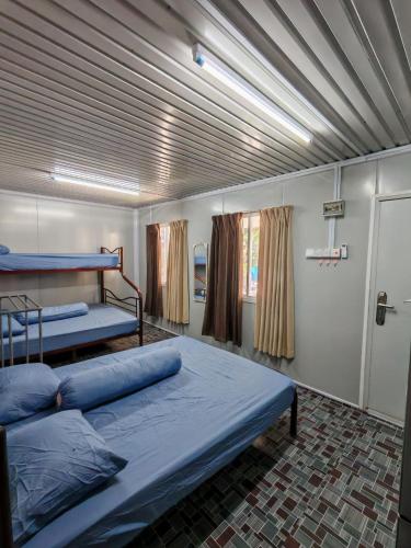 Ένα ή περισσότερα κρεβάτια σε δωμάτιο στο STUDIO HOMESTAY Arjuna