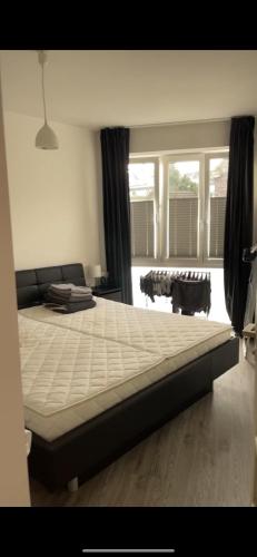 En eller flere senge i et værelse på Casa DonD