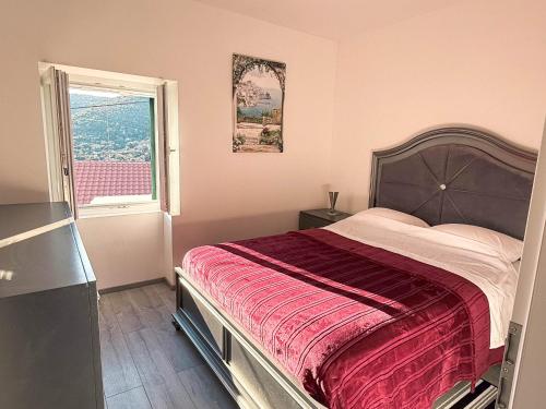 a bedroom with a large bed and a window at Private House 3 Bed, 3 Bath In Luka Dugi Otok in Luka