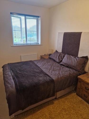 a bedroom with a bed and a window at Lovely and Cosy Double Room in Havering atte Bower