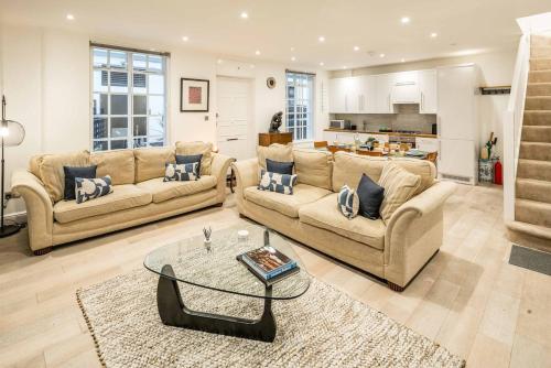 a large living room with two couches and a table at -Air Con- 3BD Mews House - Kensington Palace! in London