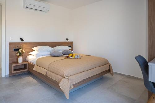 a bedroom with a large bed with pillows at LUMANIS Foro Romano in Zadar