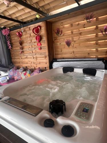 a bath tub filled with water in a room at Loft con SPA exterior climatizado Villa IRI in Pineda de Mar