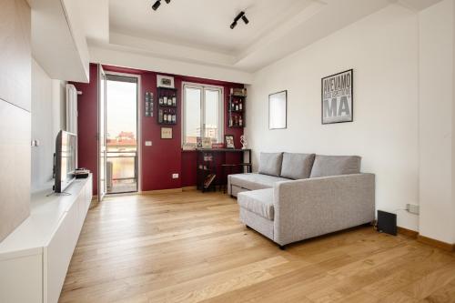 a living room with a couch and a tv at Stay&Fly Milano - Linate Airport in Segrate