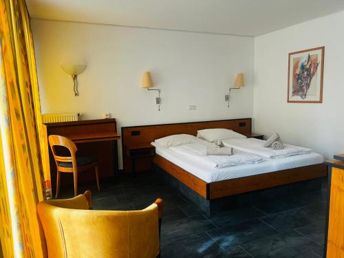 Postel nebo postele na pokoji v ubytování Hotel am Malerwinkel